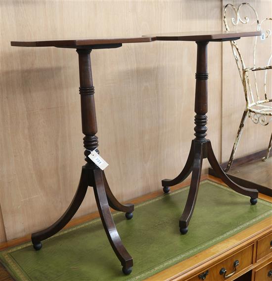 A pair of mahogany tripod tables